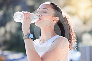 Woman, fitness and drinking water in nature for sustainability after workout, running or exercise. Fit, active and