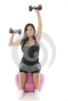 Woman fitness exercising dumbbell weights cor