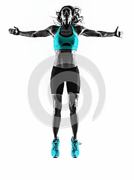 Woman fitness jumping stretching exercises silhouette