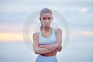 Woman, fitness and portrait in city for exercise, cardio training and wellness for sunrise or activity. Indian athlete