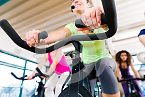 Woman at Fitness Spinning on bike in gym