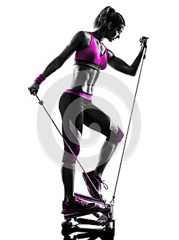 Woman fitness stepper exercises silhouette