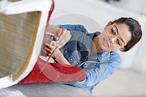 woman fixing chair