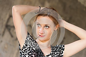 Woman Fixing Hair with Hairpin