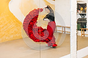 Woman Flamenco dancer turn dancing on the studio