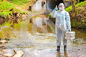 Woman with flask for expertise. Environmental pollution