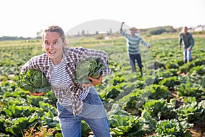 Woman fleeing farm field with stolen cabbages