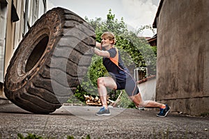 Woman flipping a tire crossfit training