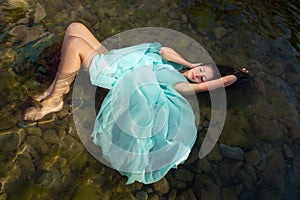 Woman floating in beach waters