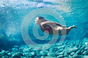 Woman floating in Natural Pool