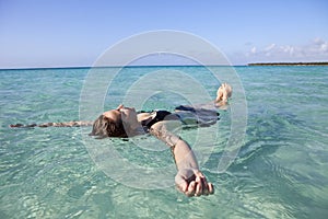 Woman floating in the sea