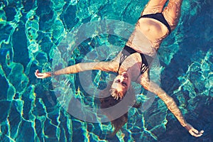 Woman Floating in Water Relaxing photo