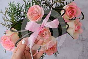 Woman florist making flowers bouquet Flowers arrangement in box created by florist wedding gift. Rose roses bouquet