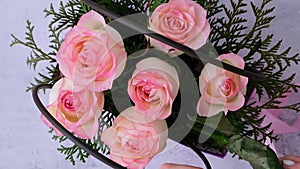 Woman florist making flowers bouquet Flowers arrangement in box created by florist wedding gift. Rose roses bouquet