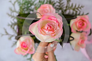 Woman florist making flowers bouquet Flowers arrangement in box created by florist wedding gift. Rose roses bouquet