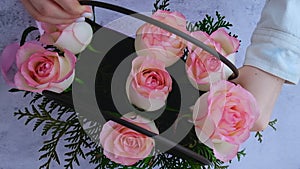 Woman florist making flowers bouquet Flowers arrangement in box created by florist wedding gift. Rose roses bouquet