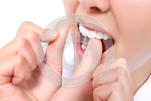 Woman Flossing Her Teeth