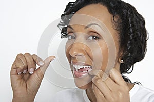 Woman Flossing Teeth photo