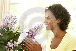 Woman Flower Arranging At Home