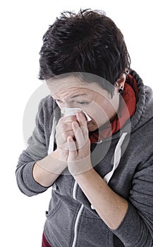Woman with the flu blowing nose