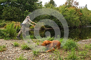 Woman Fly Fishing Small Stream For Trout