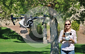 Woman Flying High-Tech Camera Drone