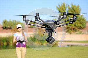 Woman Flying a High-Tech Camera Drone