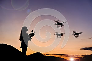Woman flying three drones