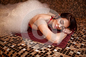 Woman in foam, turkish bath, hamam