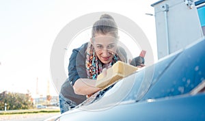 Woman foaming her car