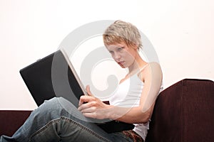 Woman focused on laptop