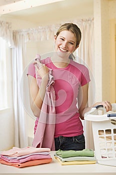 Woman Folding Laundry photo