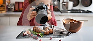 Woman food photographer taking closeup of mushrooms