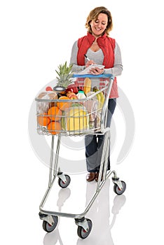 Woman food shopping with trolley isolated