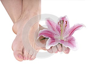 Woman foot with flower lily.