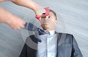 Woman foot in high-heeled shoes stands on man head