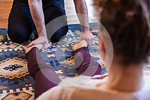 Woman at a foot reflexology session