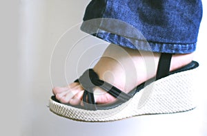 Woman foot with sandal photo