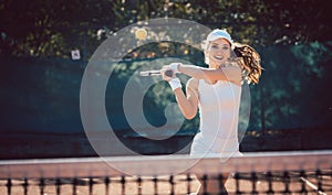 Woman forcefully playing tennis