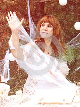Woman in the forest. fantasy image. Sorceress, spider web of thread