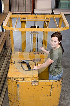 Woman on forklift truck