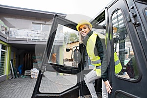 Woman forklift truck driver in an industrial area.