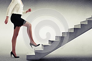 Woman in formal wear walking up stairs