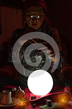 Woman fortune teller doing sorcery