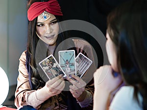 Woman fortune teller forecast destiny by tarot card