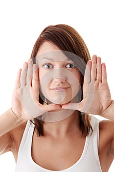 Woman framing her face with her hands