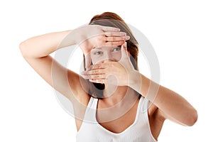 Woman framing her face with her hands