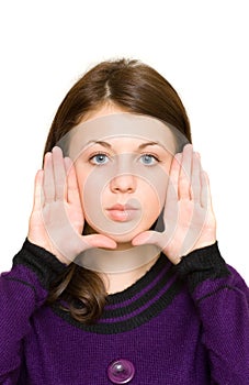 Woman framing her face with her palms