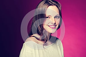 Woman freckle portrait on color background red and pink