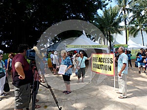 Woman of Free Access Coalition protest Pro Bowl Beach Party talk